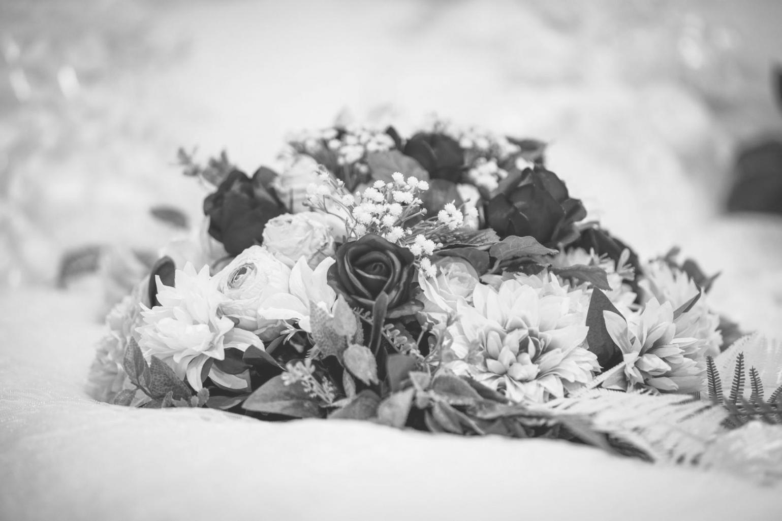 Students working on floral arrangements in classroom setting