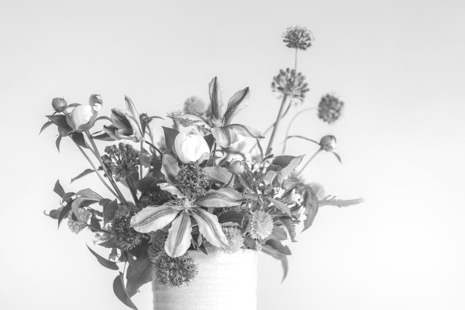 Professional floral design workspace with tools and materials